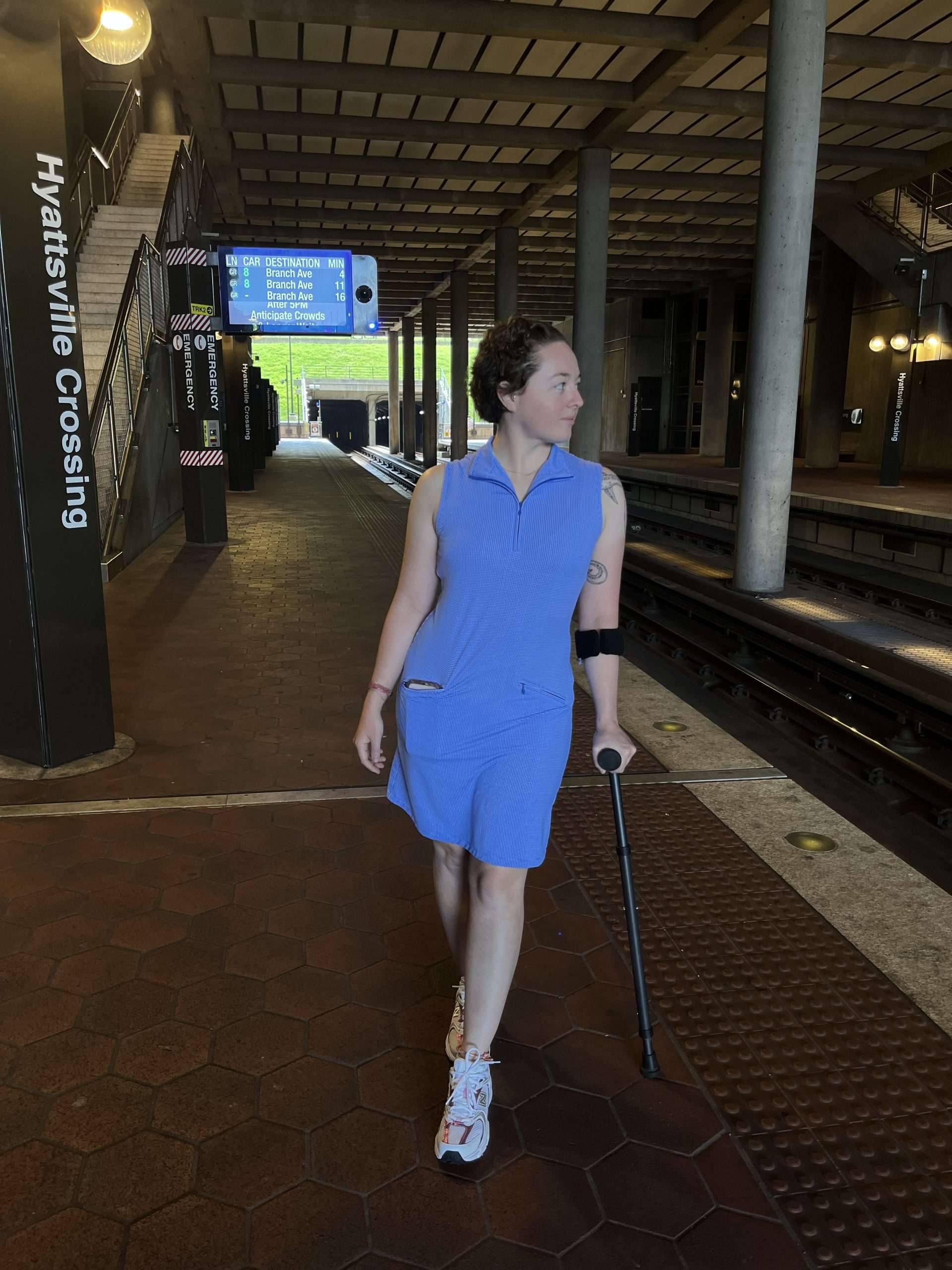 Person with in-motion crutcheswalking at Hyattsville Crossing station.