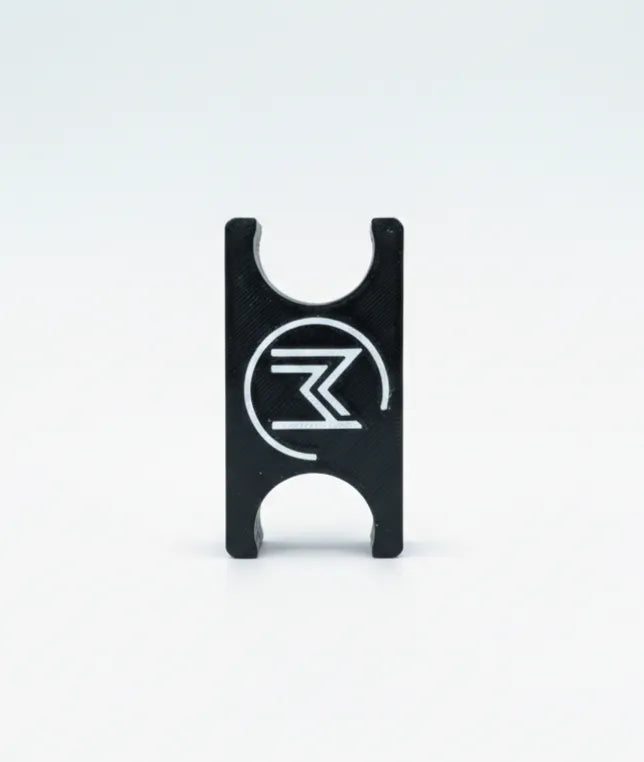 Close-up of black in-Motion Handy Clip with white logo