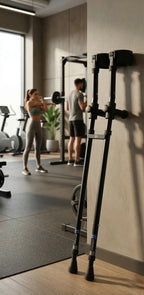 Forearm crutches with in-Motion Handy Clip leaning on a gym wall