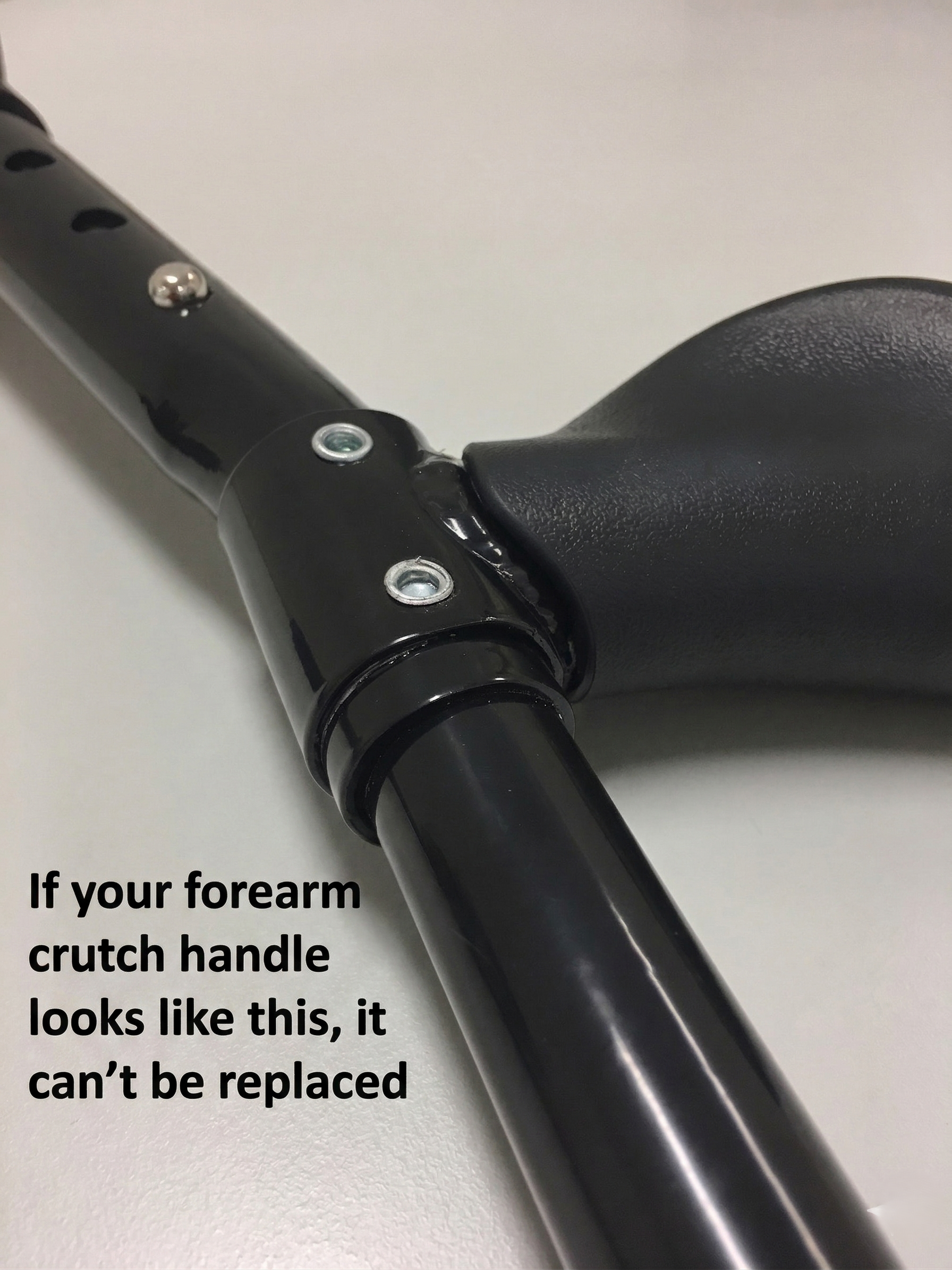 Older-style in-Motion forearm crutch handle marked for replacement