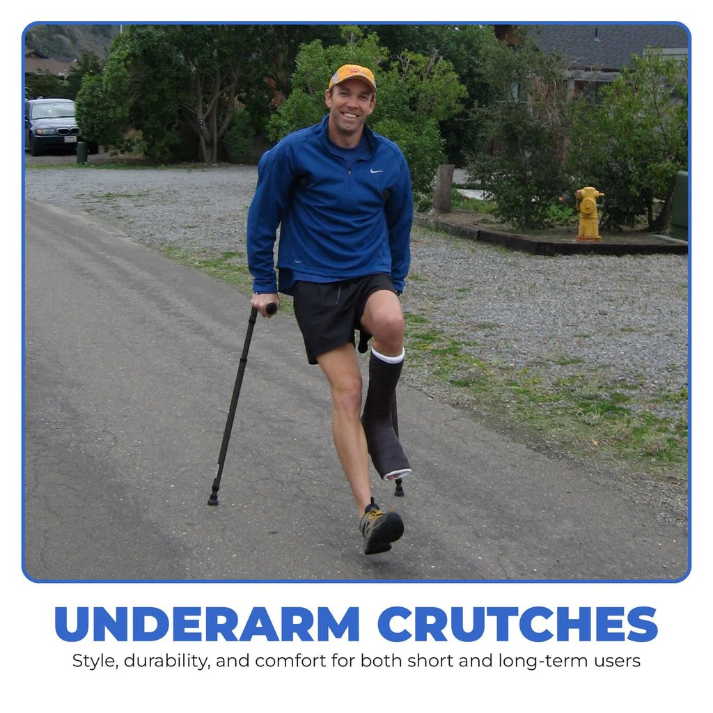 Man walking on a road with in-Motion Pro underarm crutches